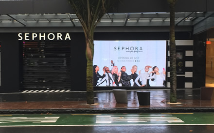 Semi-transparent LED screen located in the shop front.