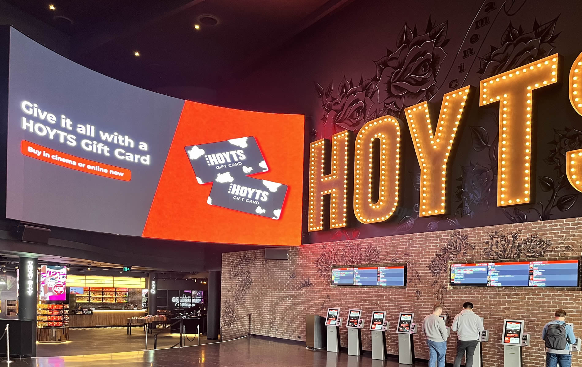 Large high-quality concave LED screen hanging in a cinema.