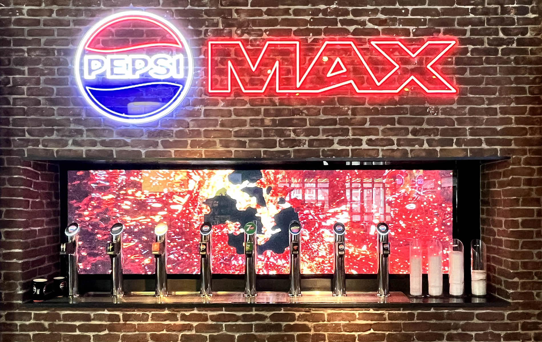 High-quality LED screen backdrop behind a drink dispenser.